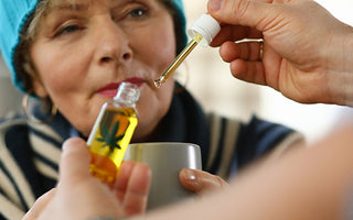 Senior Woman being given CBD tincture