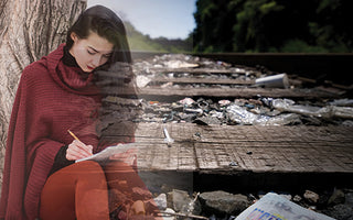 Railroad tracks with litter and an overlay of young woman writing