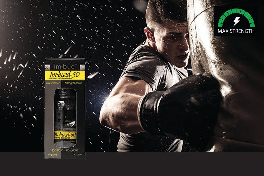 Our 50ng CBD capsule inset over a male boxer landing a punch on a punching bag