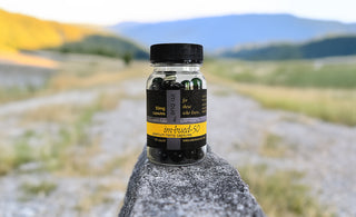 50mg capsules bottle on Rock