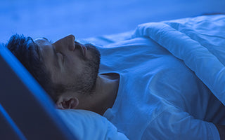 Man sleeping in blue light