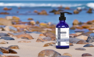 800mg CBD lotion placed on rocky beach