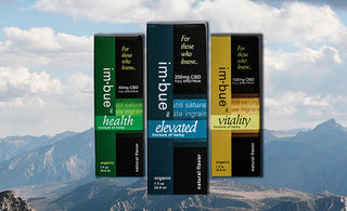 3 tinctures hovering over a mountain backdrop