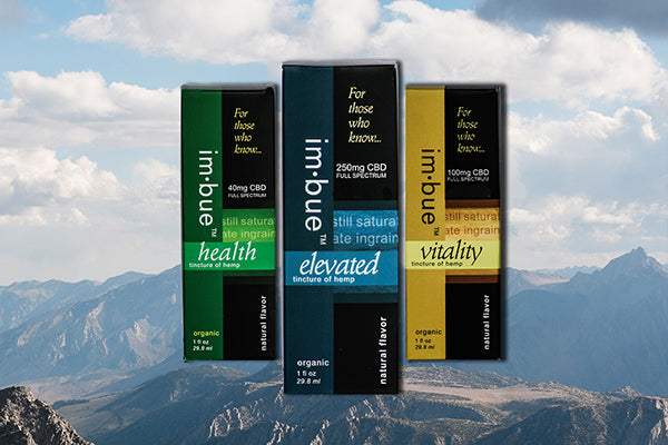 3 tinctures hovering over a mountain backdrop